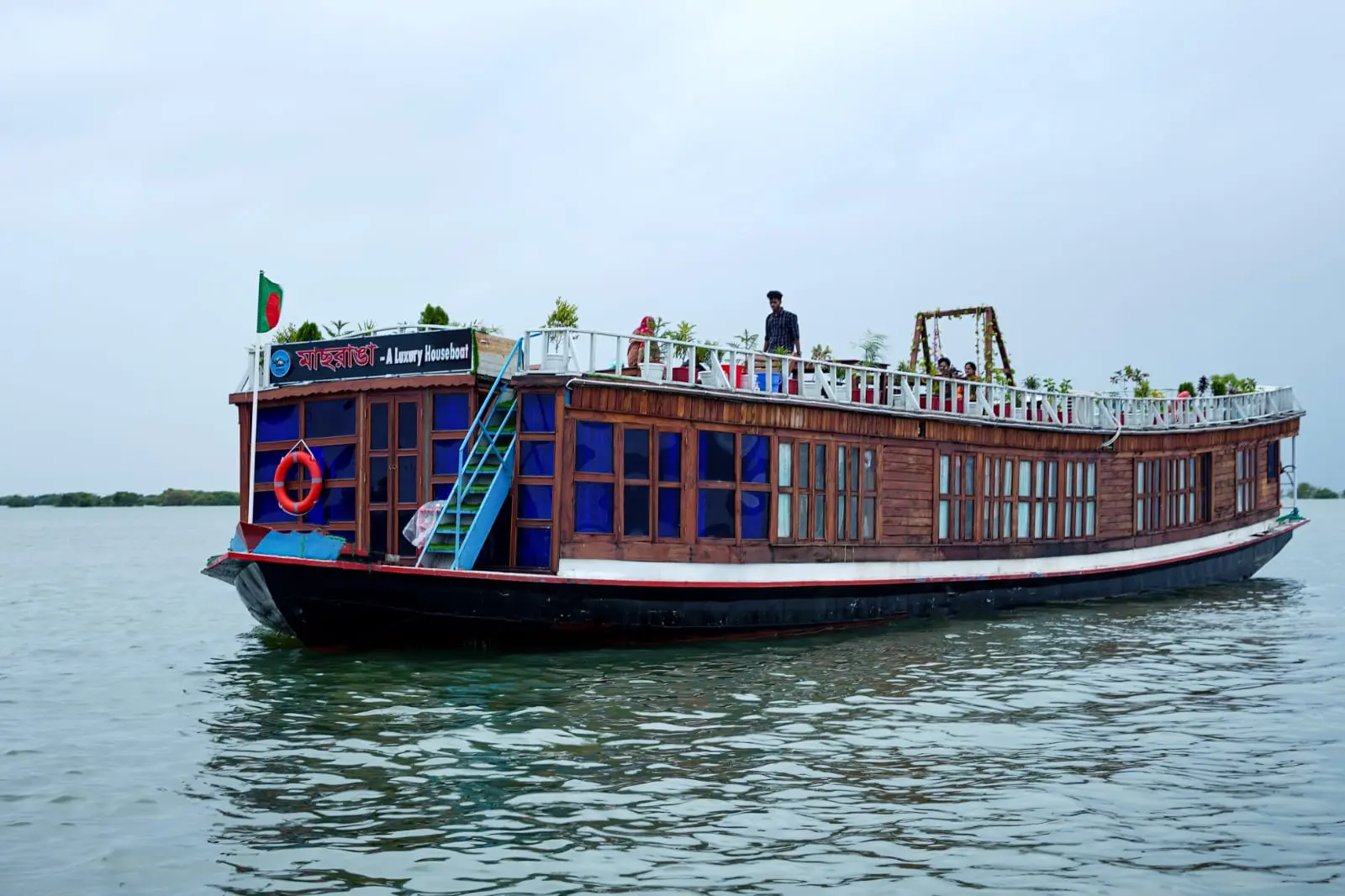 Wooden luxury houseboat on Tanguar Haor