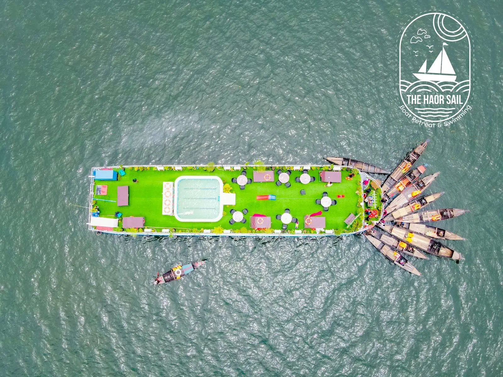 Aerial view of a Tanguar Haor houseboat with sun-deck and small boats
